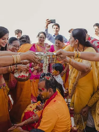 A beautiful moment where the women of the family come together to perform a ritual for the groom.