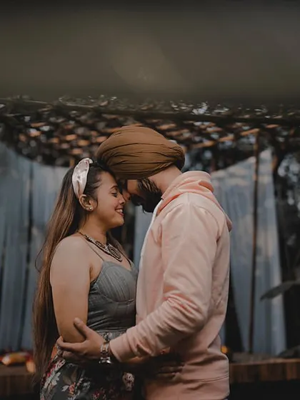 An intimate and moody shot of Avneet and Lavleen at the Bali set. The soft lighting and their close embrace create a deeply romantic and atmospheric portrait.