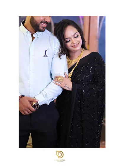 A sweet and candid moment with the woman resting her head on her partner's shoulder, showcasing a natural and loving connection.