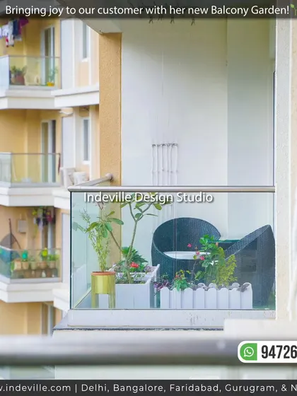 An exterior view of the transformed balcony. Even from a distance, the greenery and clean design add significant aesthetic appeal to the apartment's facade.