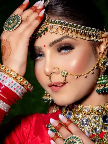 A close-up of the classic, timeless red bridal makeup that every Indian makeup artist must master. I teach you how to create this flawless, radiant glow with bold eyes and a perfect red lip.