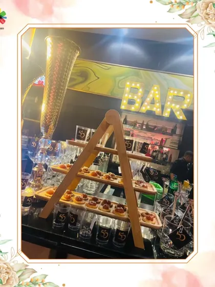 A detailed look at our bar setup for a 50th birthday celebration at Sahara Star, Mumbai. The display includes tiered appetizers and custom-branded glassware, showcasing our attention to detail.