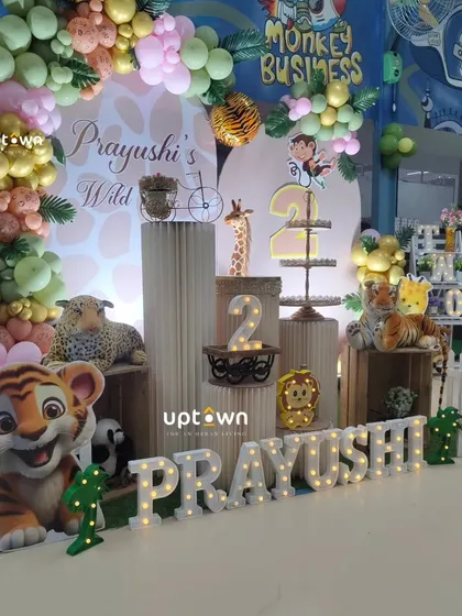 A different angle of the "Wild Two" party, highlighting the tiered pedestals and light-up name.