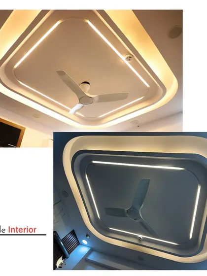 This stunning ceiling features a multi-layered tray design with both internal and external strip lighting, creating a dramatic and ultra-modern look.