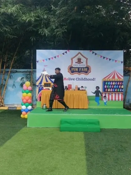 Kicking off the show at a school fun fair. My act is designed to be high-energy from the very start, grabbing the attention of the crowd with quick, visual magic.