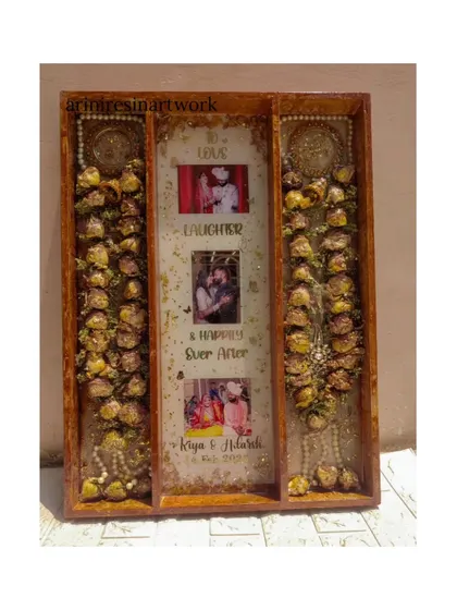 Another look at the impressive full varmala preservation frame. The wooden frame adds a rustic and elegant touch, perfectly complementing the preserved flowers within.