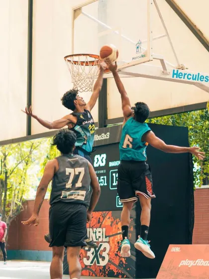 Going up for a block during an INBL 3x3 game. Aggressive, smart defense wins championships.
