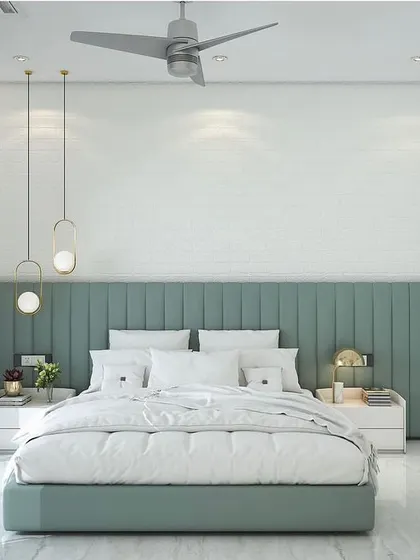 A bedroom design concept featuring a soothing sage green color scheme. The room has a channel-tufted headboard, minimalist pendant lights, and white paneled wardrobes for a clean, modern look.