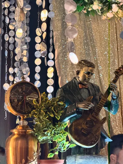 A close-up of a musician statue, one of the many artistic props we use to enhance our bar themes.