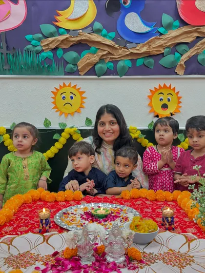 A group photo of our little stars and their teacher around the Diwali setup. The classroom was filled with light, color, and the happy smiles of our children.