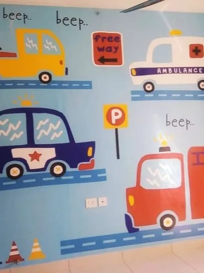 A playful and educational wallpaper featuring cartoon vehicles like a police car, ambulance, and fire truck. The "beep beep" text adds a fun, interactive element for a toddler's room.