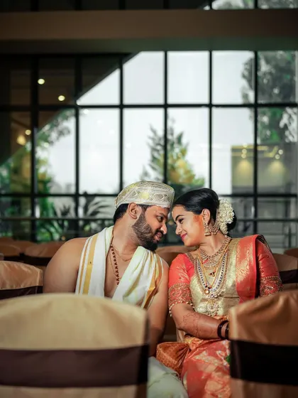 A quiet, intimate moment between the couple, their faces close together, capturing the warmth and love they share.