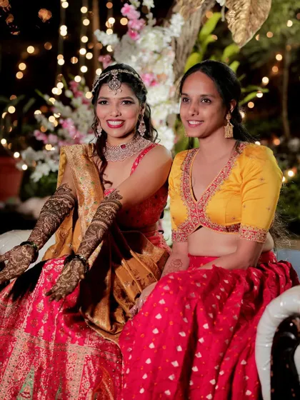 Our client Namratha looking stunning in her sangeet lehenga. The yellow embroidered blouse contrasts beautifully with the red skirt.