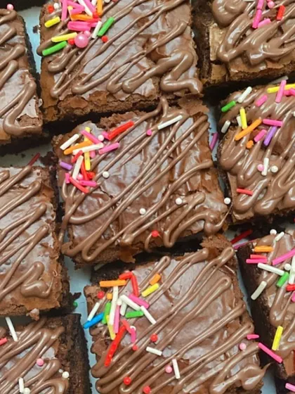 Kids absolutely love these Nutella fudge brownies with a chocolate drizzle and colorful sprinkles. They are a guaranteed hit at any party.