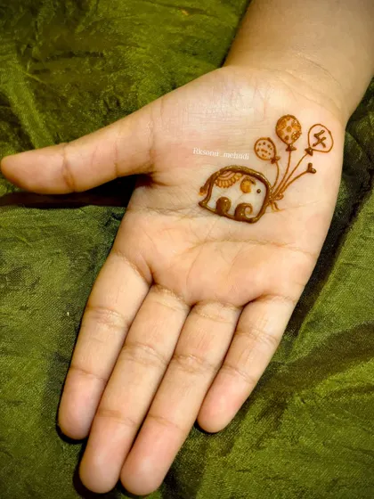 Even the little ones can enjoy mehndi! This adorable and minimal elephant design is perfect for a child's birthday party, offering a touch of fun without being overwhelming.
