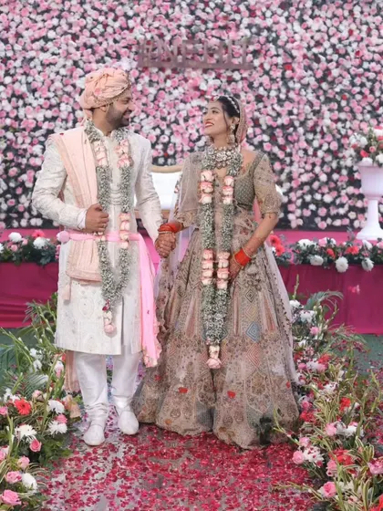 A romantic shot of the couple. Her smile lights up her face, and her makeup enhances her natural beauty perfectly.