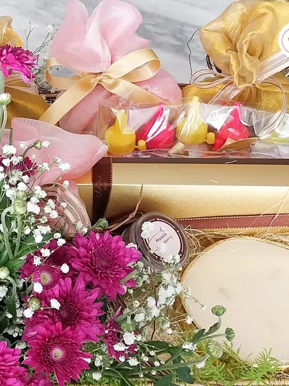 A close-up of the traditional hamper, showing the chocolate diyas and other sweets, all artfully arranged.