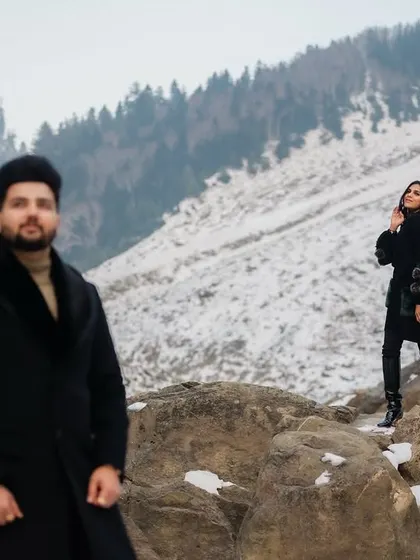 A quiet embrace in the crisp winter air of Sonmarg. This shot focuses on the warmth and connection between the couple, with the stunning, snow-covered mountains creating a serene and powerful backdrop for their pre-wedding story.