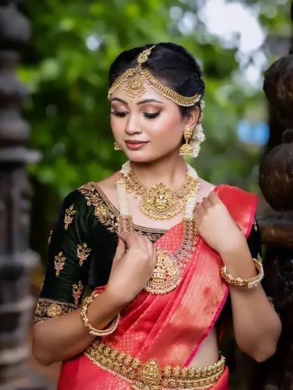 A closer look at the details of a temple jewellery set. Notice the fine carvings on the choker and the matching jhumkas, designed to make you feel like royalty on your wedding day.