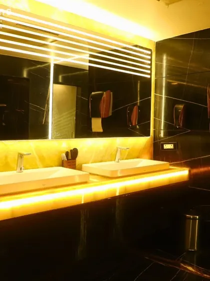 Our wet areas are designed with luxury and hygiene in mind, featuring elegant black marble, modern fixtures, and ambient lighting for a premium experience.