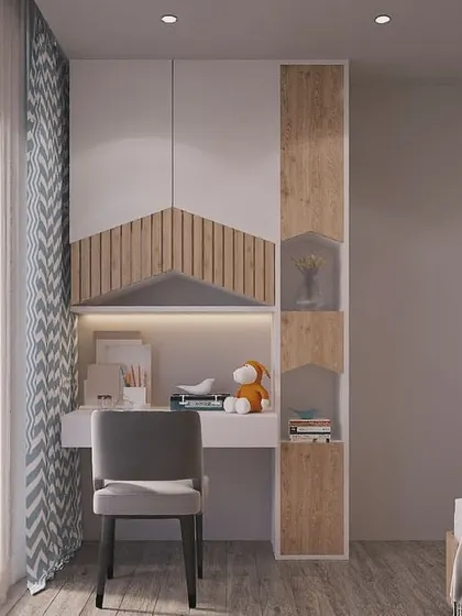 A bright and cheerful study nook for a child's room. The design features a mountain-shaped motif on the cabinetry, combining playful design with practical storage and a well-lit workspace.