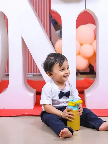 A sweet 'Teddy Bear' themed first birthday party, with soft colors, cute teddy bear props, and a cozy setting, perfect for a warm and loving celebration.