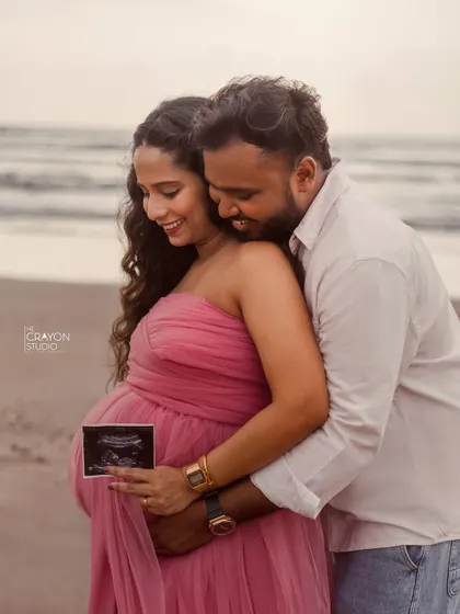Sharing the first glimpse of their baby with a sonogram picture. This is such a special moment to capture during a maternity shoot, full of love and excitement.