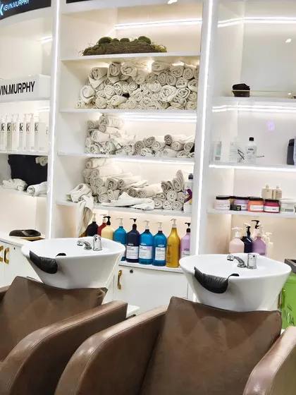 A look at my hair wash station, fully stocked with premium Kevin Murphy products and fresh towels, ensuring a clean and luxurious experience every time.
