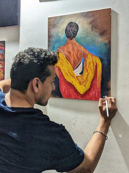 Adding the final touches to an acrylic painting. This moment is about ensuring every detail is just right before the artwork goes to its new home.