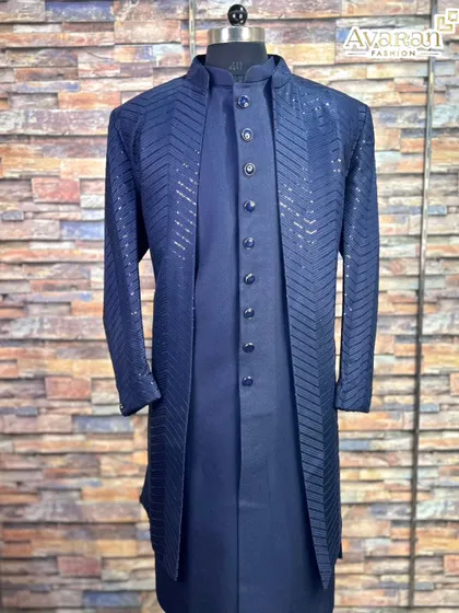A clear, full-length shot of the navy blue Lakhnavi sherwani, a perfect rental choice for a traditional yet modern wedding look.