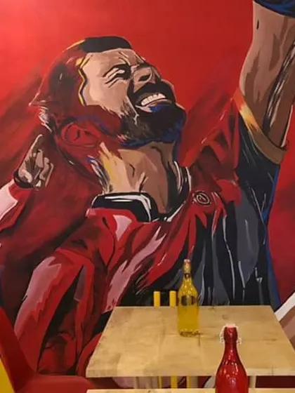 The final setup at Ee Sala Cup Namde Cafe, with our mural as the main event. We design our art to complement the interior design and create a cohesive theme.