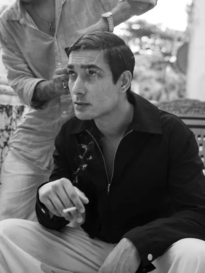 A behind-the-scenes style shot, capturing a candid moment of preparation. This adds an authentic, unposed feel to a portfolio.