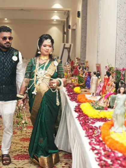 A beautiful shot of a couple walking past their baby shower rukhwat. The display adds a wonderful traditional element to their celebration.