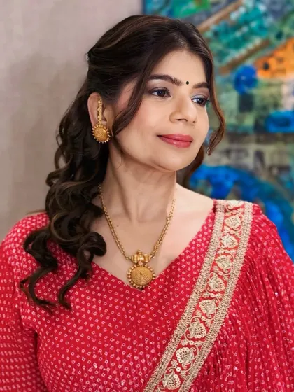 Another angle of the festive look, showcasing the beautiful curls and elegant styling.