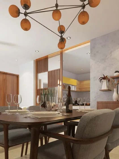 The dining area flows into the living room, unified by warm wood tones and a modern industrial chandelier.
