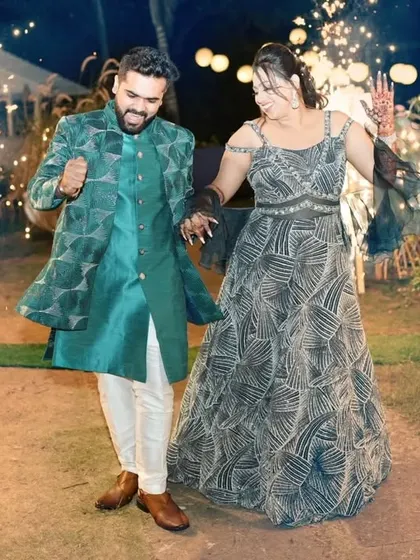 This is the energy I design for. A happy client making a grand entrance at his sangeet in a custom teal Indo-Western jacket. The geometric pattern and confident fit are made for movement, celebration, and owning the dance floor.
