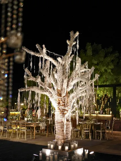 The magnificent crystal-draped tree that served as the centerpiece for our Gatsby-themed Sangeet, surrounded by candles to create a magical glow.