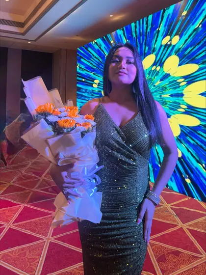 This shimmery olive green dress is perfect for a party. It's fun, glamorous, and has just the right amount of sparkle for a celebration.