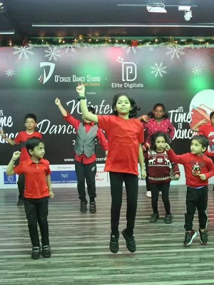 A mid-air jump captures the excitement of our kids' holiday performance.