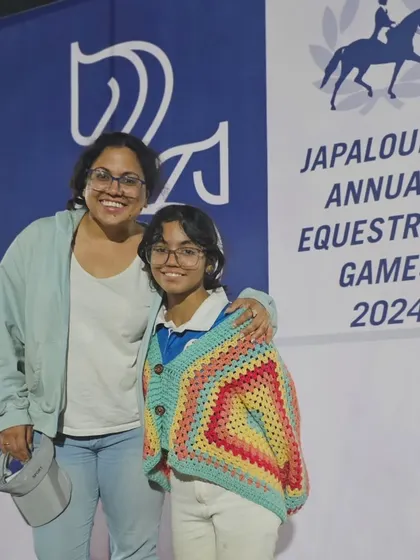 Two members of the REA family smiling for the camera. The bonds formed here extend beyond the arena, creating a network of friends and supporters.