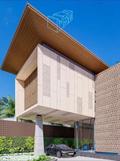 The entrance of a cliffside residence in Goa, featuring a dramatic cantilevered volume. This bold architectural move creates a covered carport while establishing a powerful, modern aesthetic.