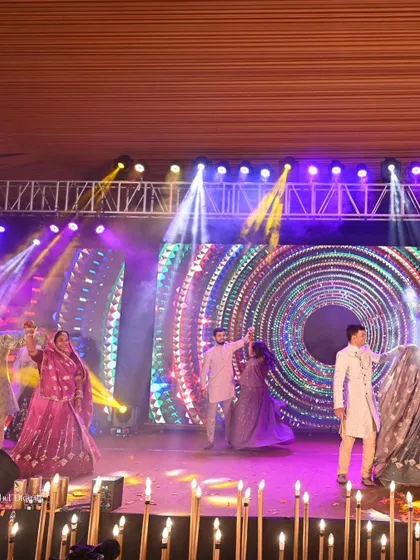 A full family performance with multiple generations on stage together. These large group numbers are the heart of a sangeet, and we coordinate them to look grand and feel joyous.