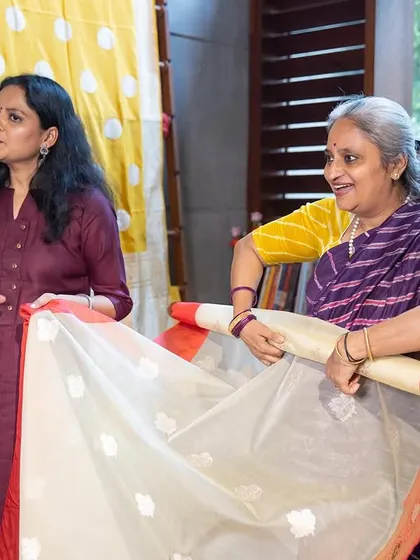 In my workshops, I provide hands-on practice. Here, a student is learning how to pleat a saree on a stand, a method that simplifies the process, especially for beginners.