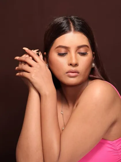 This angle highlights the soft contouring and the overall natural feel of the makeup.