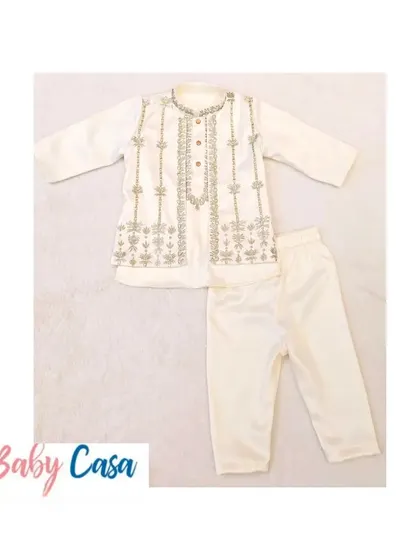 A detailed look at our embroidered off-white kurta pajama. The craftsmanship and quality of the fabric make it a luxurious choice for your little one.