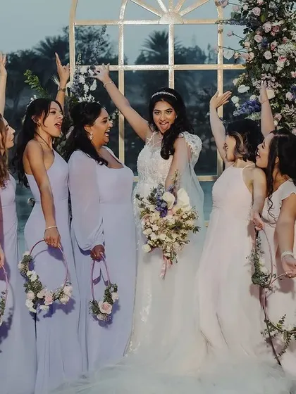 The bride and her tribe. This joyful photo with her bridesmaids captures the fun, friendship, and excitement of the wedding day, a memory to be cherished forever.