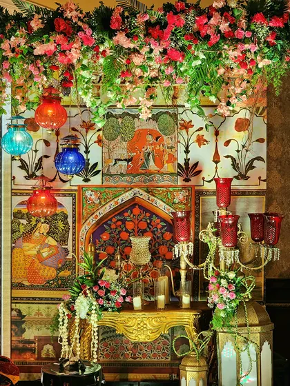 Another angle of the detailed Sufi Night decor, showing the beautiful interplay of light, color, and texture. The combination of flowers, art, and traditional objects creates a truly immersive experience.