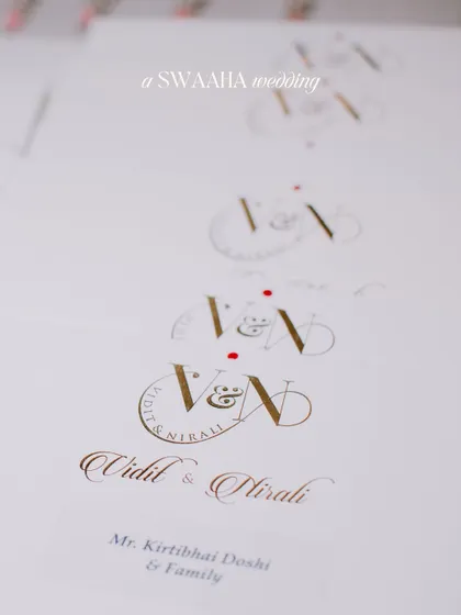 A shot of the elegant wedding stationery, featuring the couple's custom monogram.