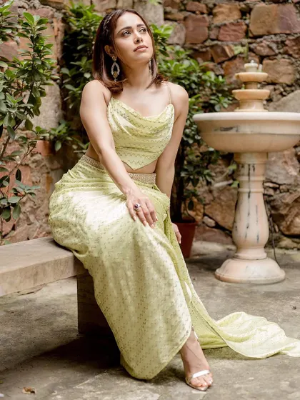 The full, flowing silhouette of this lime green indo-western outfit. It’s a fresh, modern choice for a mehendi or a sundowner.