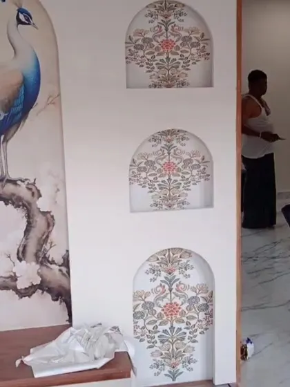 An intricate design combining a large peacock mural with smaller, detailed patterns in arched niches, showcasing our ability to create complex, layered compositions.